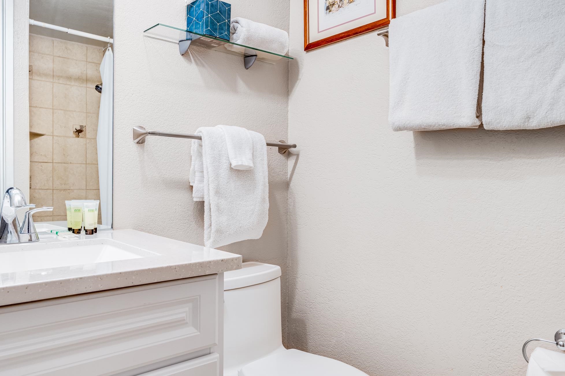 2191 South Kihei Road, Unit 3402 Kihei, HI 96753 - Photo 30 of 50 a bathroom with a granite countertop sink a toilet and shower