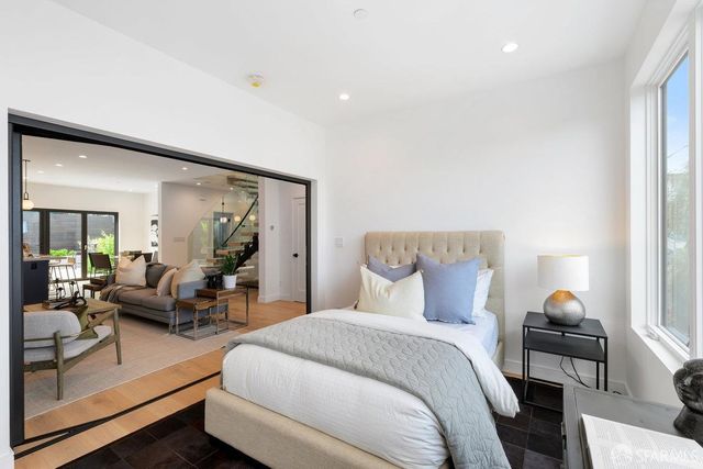 a view of a dining room with furniture and a potted plant