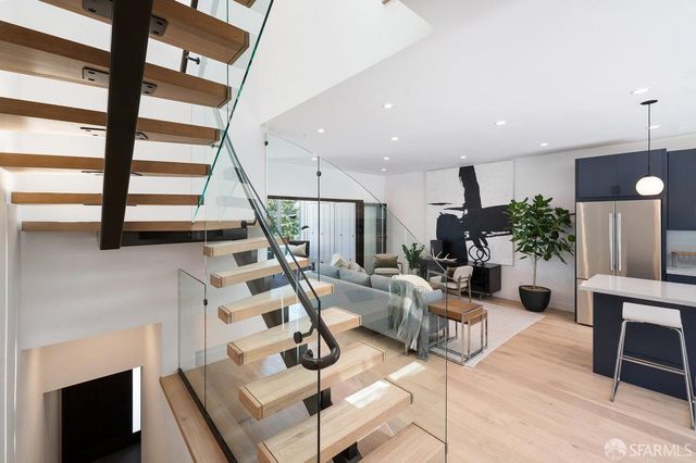 a view of a patio with couches and potted plants