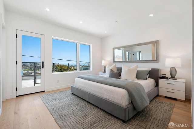 a front view of a house with outdoor seating