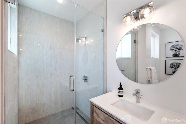 a view of a patio with couches table and chairs and potted plants