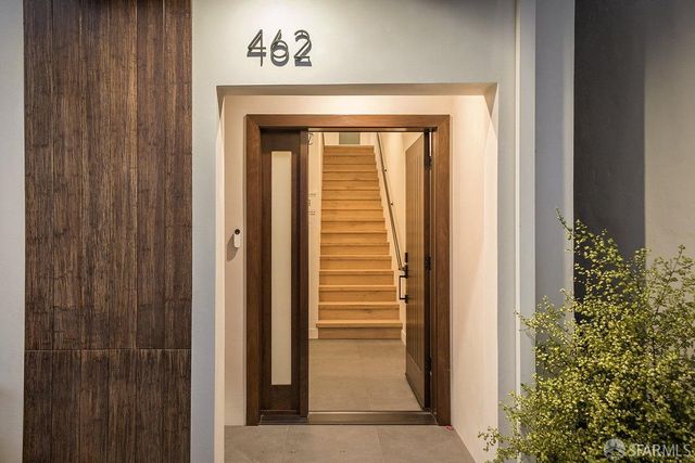 a bedroom with a large bed and a view of bedroom