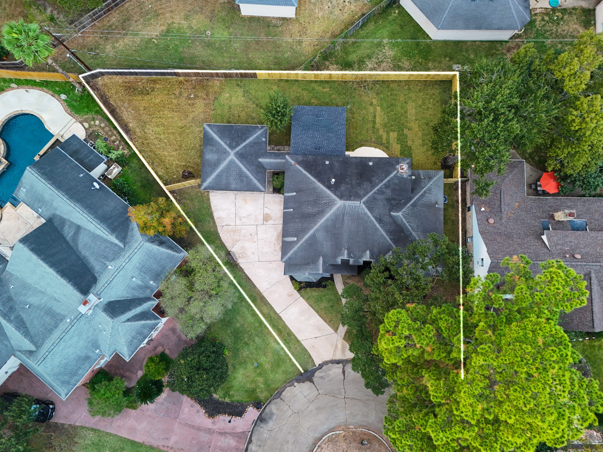 8006 Vickridge Lane Spring, TX 77379 - Photo 45 of 50 This aerial view highlights the full property layout, showcasing the generous .25-acre lot, wide driveway, and fenced backyard. A clear look at how much space this home offers inside the cul-de-sac.