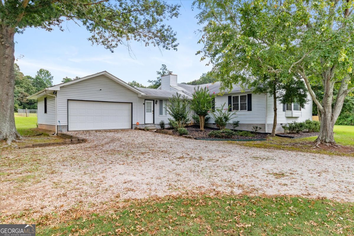 944 Thurman Road Stockbridge, GA 30281 - Photo 1 of 1 a view of a house with a yard and large tree