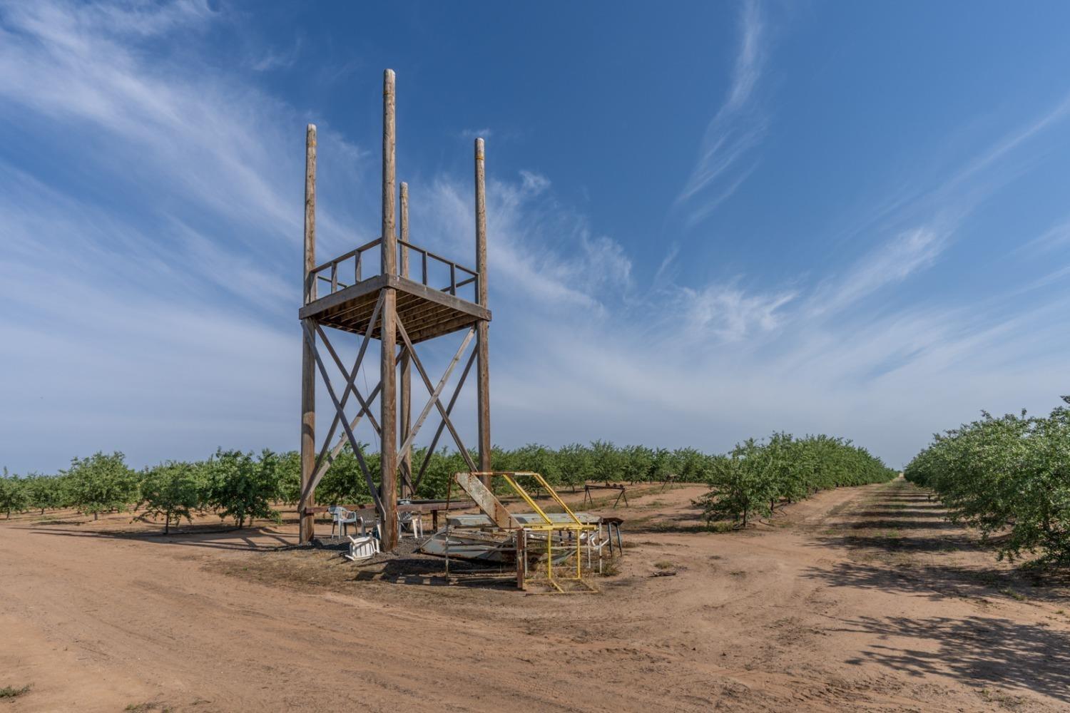 14155 Buchanan Hollow Road Le Grand, CA 95333 - Photo 18 of 46 a front view of a house with a yard and potted plants