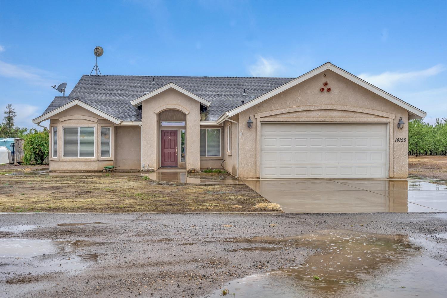 14155 Buchanan Hollow Road Le Grand, CA 95333 - Photo 24 of 46 a view of a house with a yard