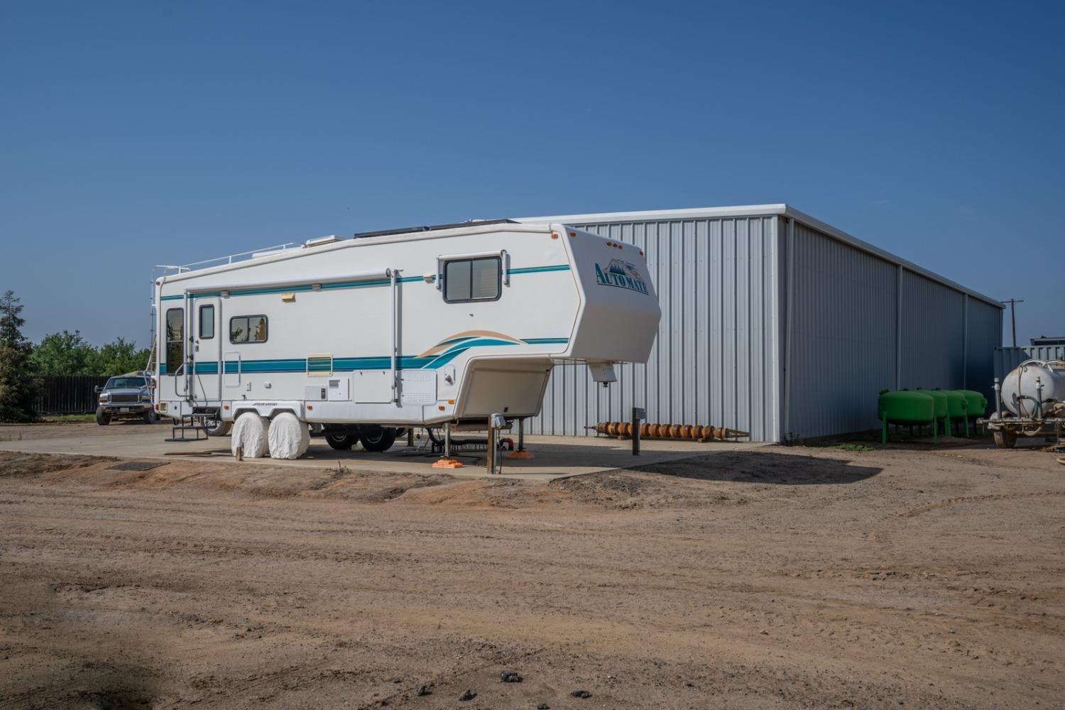 14155 Buchanan Hollow Road Le Grand, CA 95333 - Photo 26 of 46 a bench sitting in front of a building