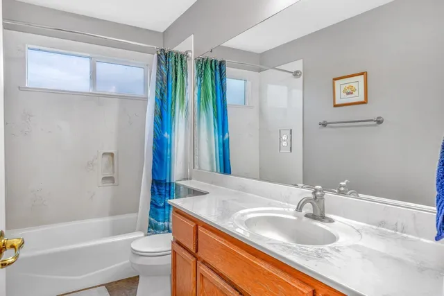a utility room with sink dryer and washer