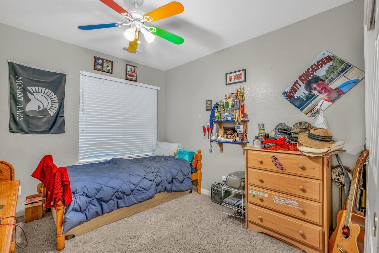 14155 Buchanan Hollow Road Le Grand, CA 95333 - Photo 32 of 46 a bedroom with a bed and furniture