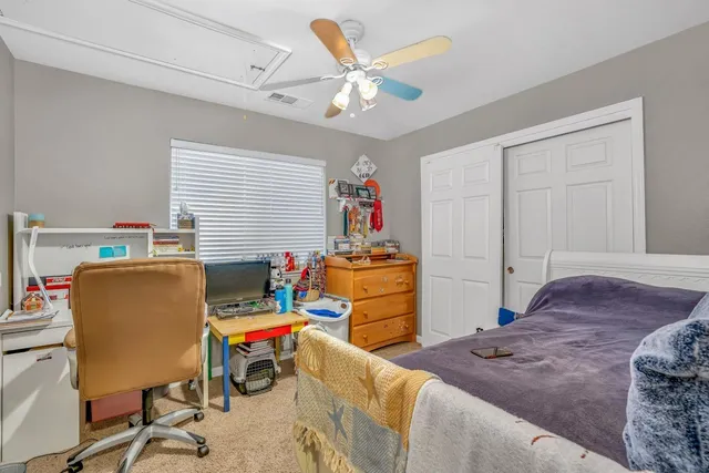a bedroom with bed and tv
