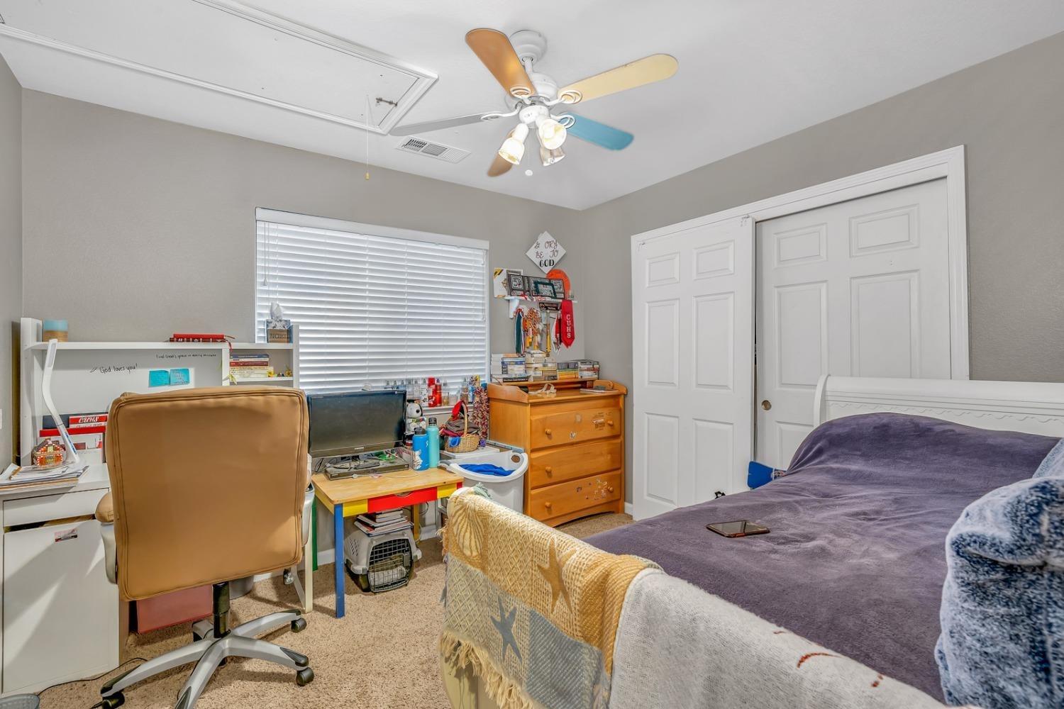 14155 Buchanan Hollow Road Le Grand, CA 95333 - Photo 34 of 46 a bedroom with a workspace