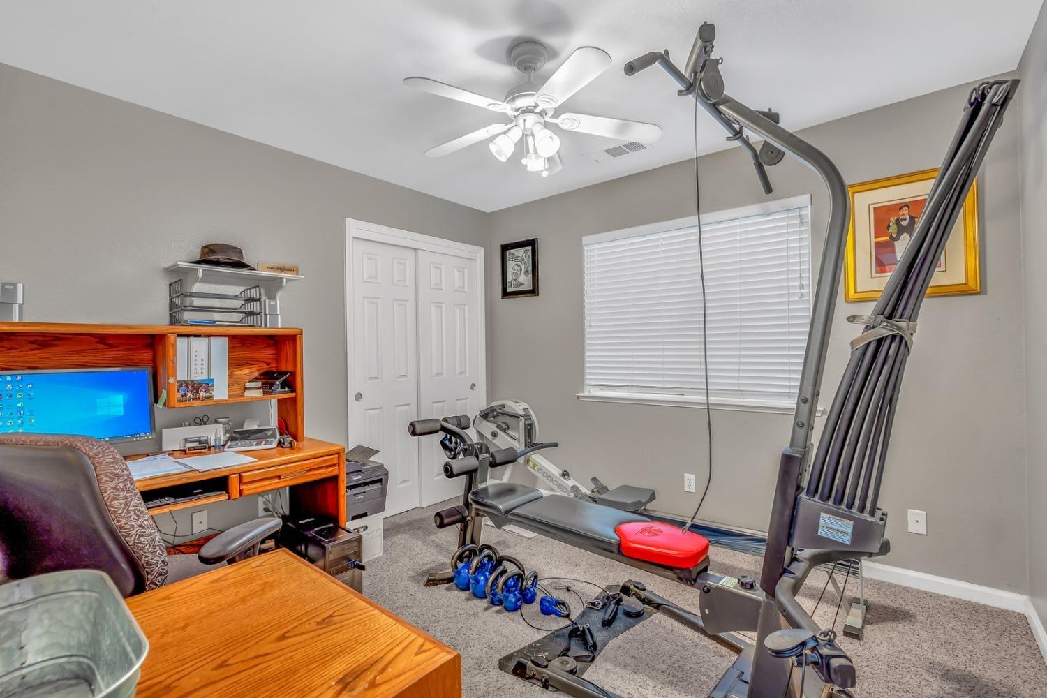 14155 Buchanan Hollow Road Le Grand, CA 95333 - Photo 35 of 46 a room with furniture and gym equipment