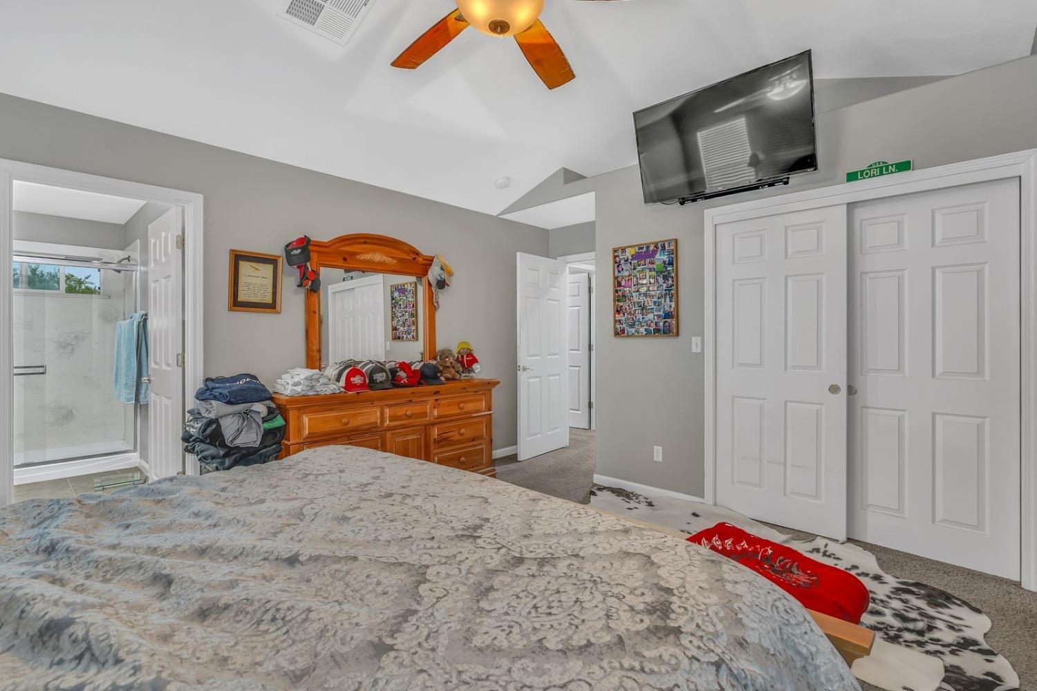 14155 Buchanan Hollow Road Le Grand, CA 95333 - Photo 36 of 46 a bedroom with bed and tv