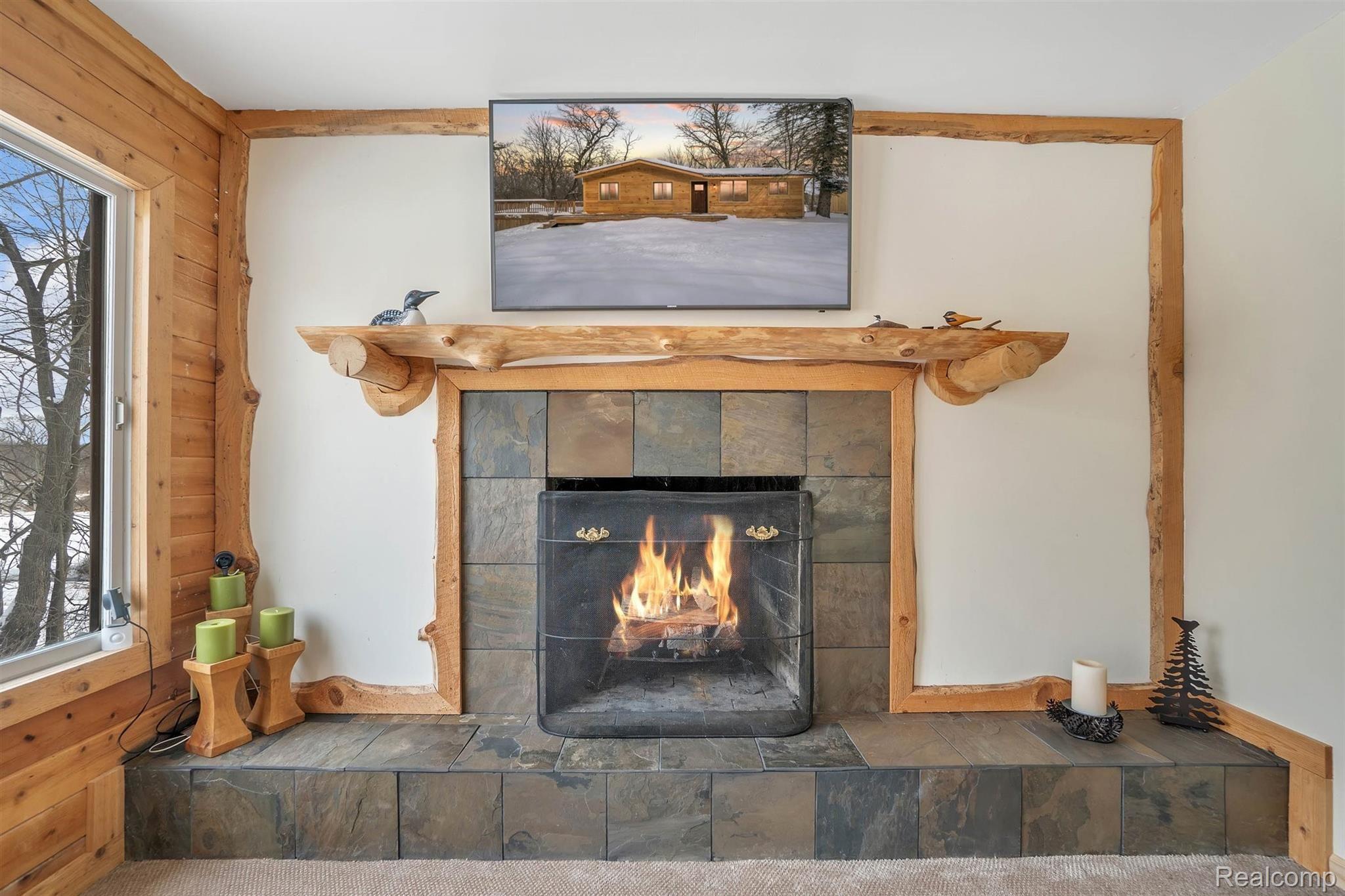 1084 Darwin Road Pinckney, MI 48169 - Photo 12 of 36 Warm and Cozy Fireplace In The Family Room