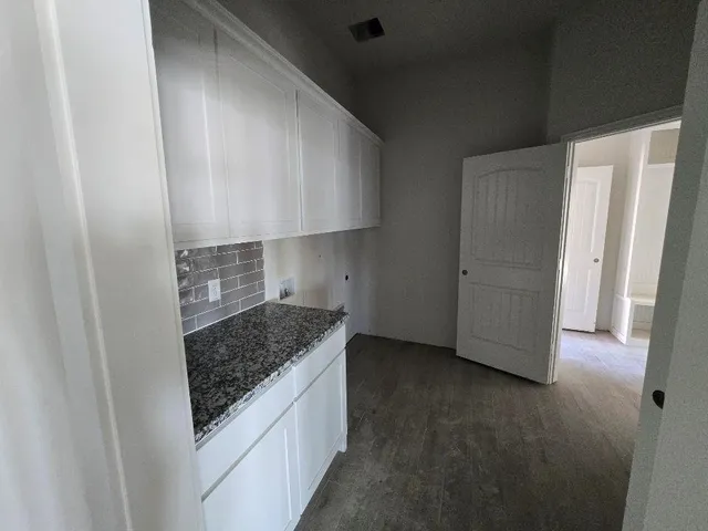 a kitchen with a sink and a refrigerator