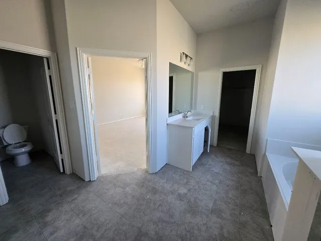 a view of a hallway and a room with a outdoor space