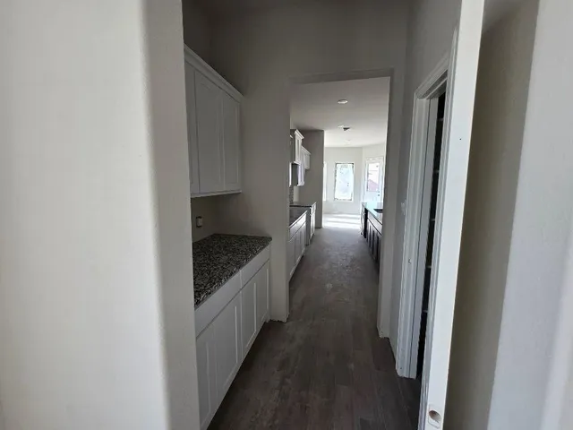 a view of a hallway view with staircase