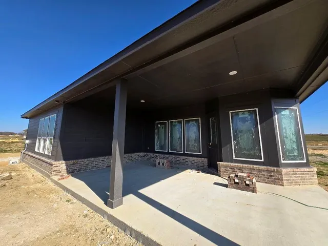 a view of a house with a patio