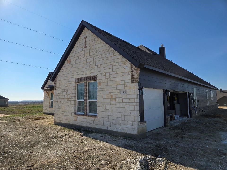 118 Hillview Trail Decatur, TX 76234 - Photo 3 of 22 a front view of a house with a yard