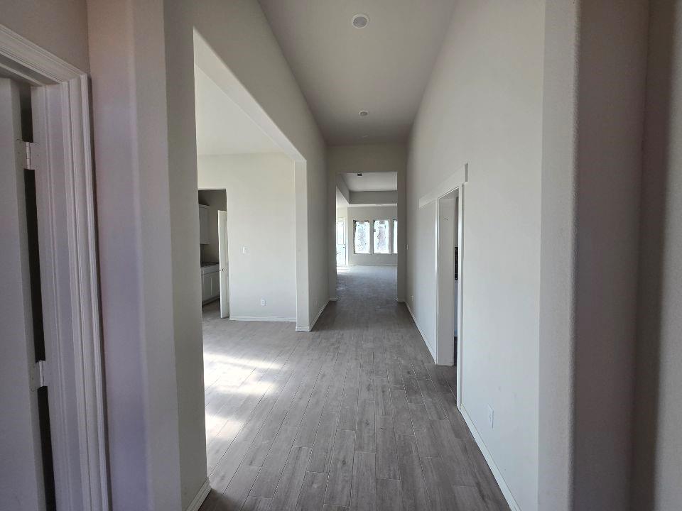 118 Hillview Trail Decatur, TX 76234 - Photo 5 of 22 a view of hallway with livingroom and wooden floor