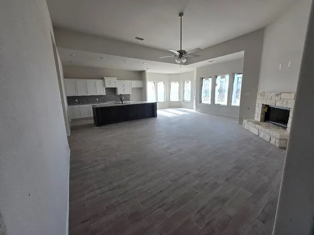 a view of a livingroom with furniture and staircase