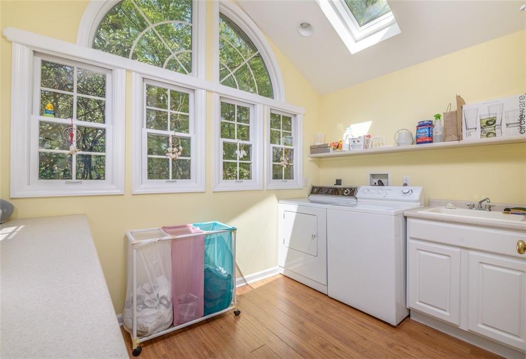 135 Witherow Road Sewickley, PA 15143 - Photo 12 of 25 This terrific addition on the first floor makes doing laundry pleasant. Skylights. Powder room is part of the addition. Access from this area to rear deck and yard.
