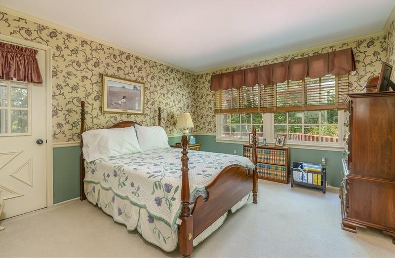 135 Witherow Road Sewickley, PA 15143 - Photo 15 of 25 First floor bedroom. Bright and quiet with views to the rear. Full bath with access from bedroom Door shown is to multi season room.