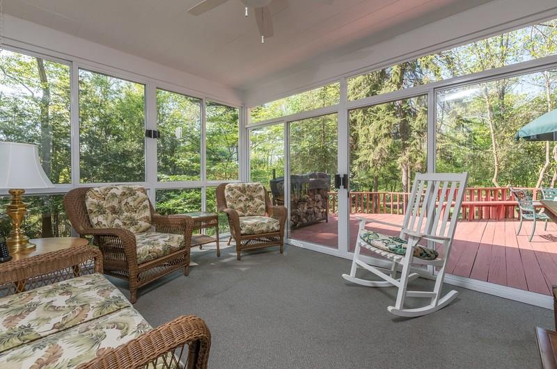 135 Witherow Road Sewickley, PA 15143 - Photo 3 of 25 You can feel the relaxation possibilities of this multi-season porch. It can be accessed from the family room,first floor bedroom and leads to the deck.