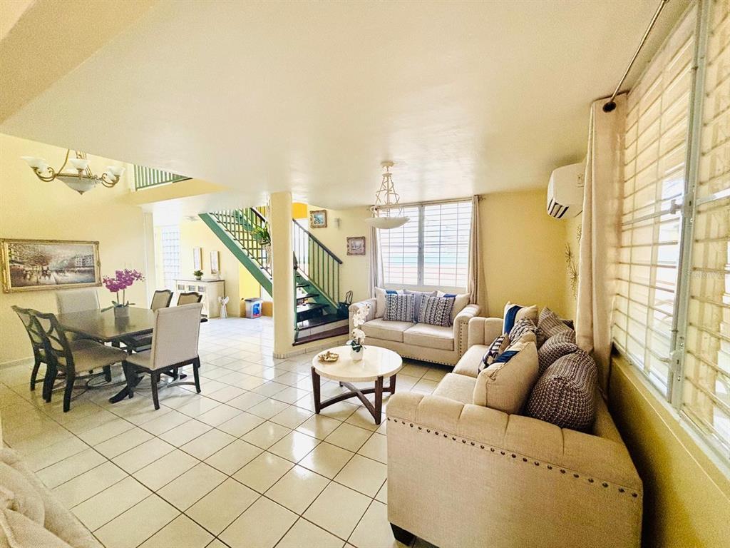 1 St Rio Grande, Unit B6 Rio Grande, PR 00745 - Photo 26 of 47 a living room with furniture and a large window