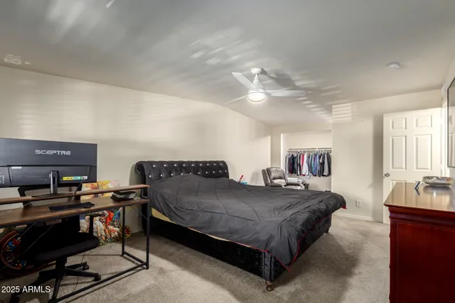 a bedroom with a bed and furniture