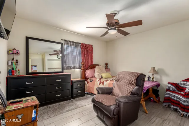 a living room with furniture and a mirror