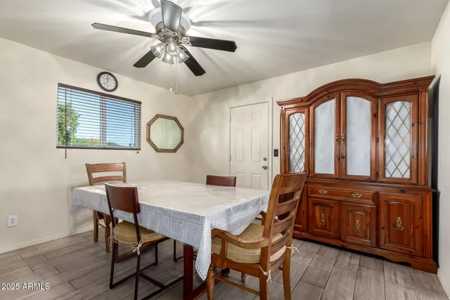 a dining room with furniture and window