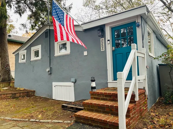 a view of house with wooden stairs