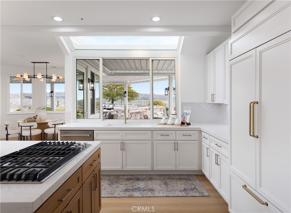 2001 Via Aguila San Clemente, CA 92673 - Photo 15 of 53 a large kitchen with stainless steel appliances granite countertop a stove and a sink