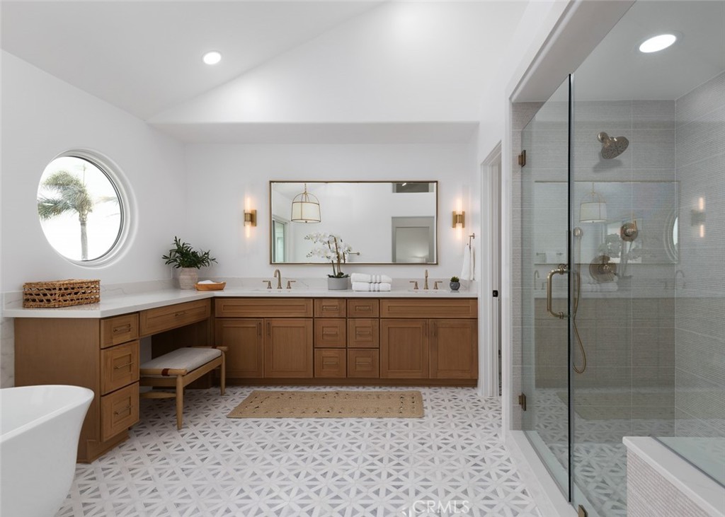 2001 Via Aguila San Clemente, CA 92673 - Photo 33 of 53 a spacious bathroom with a double vanity sink a mirror and a shower