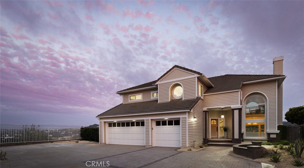 2001 Via Aguila San Clemente, CA 92673 - Photo 5 of 53 a front view of a house with a yard and garage
