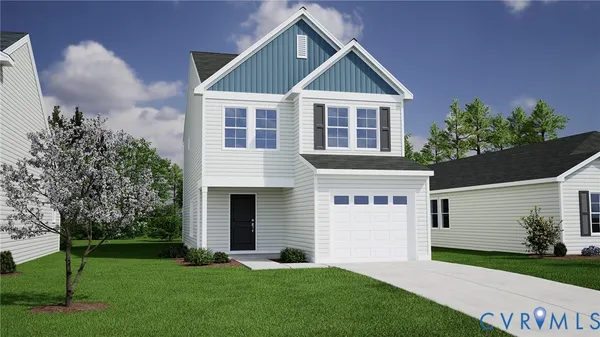 a front view of a house with a garden and yard