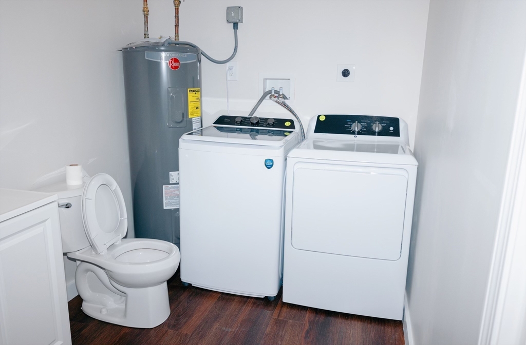 206 Treetop Avenue Springfield, MA 01118 - Photo 16 of 16 a storage room with washer and dryer