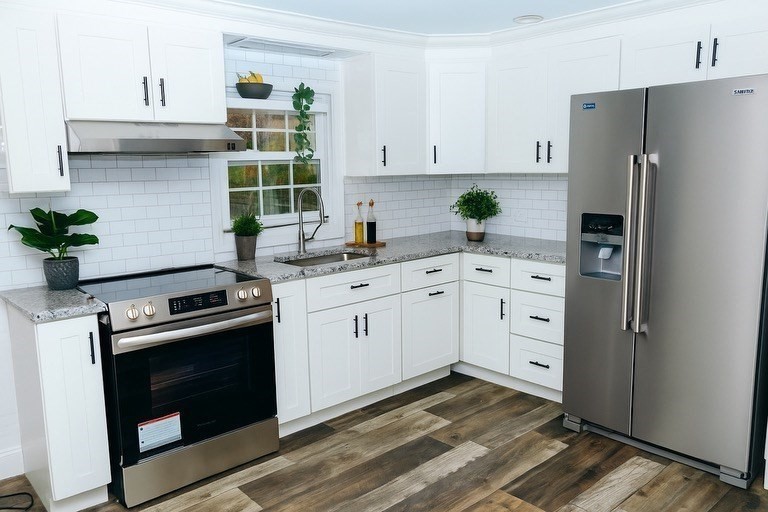 206 Treetop Avenue Springfield, MA 01118 - Photo 4 of 16 a kitchen with a sink stove and refrigerator