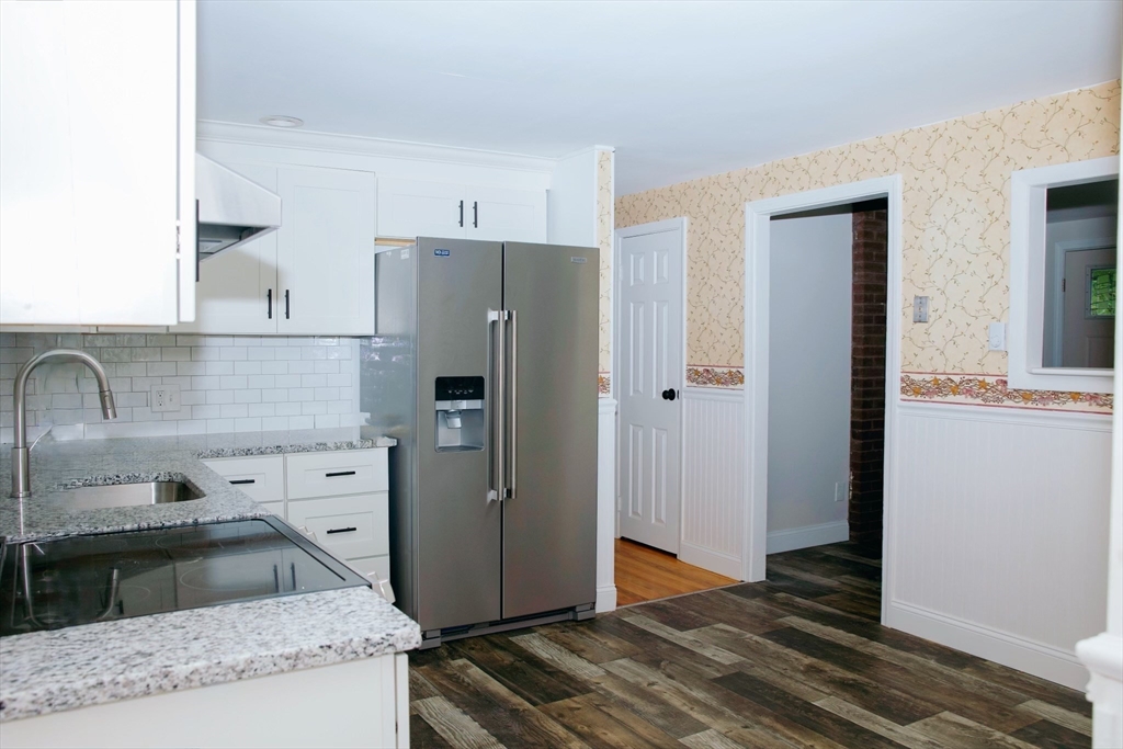 206 Treetop Avenue Springfield, MA 01118 - Photo 5 of 16 a kitchen with stainless steel appliances granite countertop a refrigerator and a sink