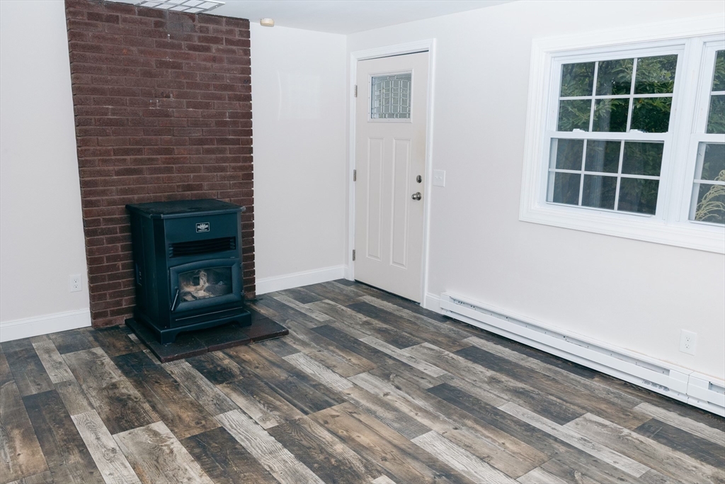 206 Treetop Avenue Springfield, MA 01118 - Photo 7 of 16 a living room with a fireplace