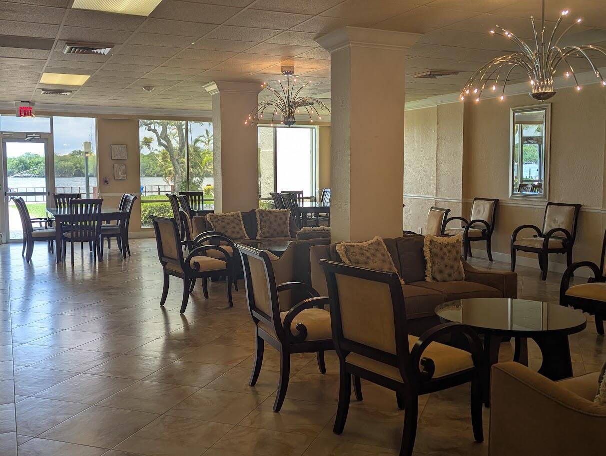 2121 North Ocean Boulevard, Unit 1006E Boca Raton, FL 33431 - Photo 58 of 64 a view of a dining room with furniture window and outside view