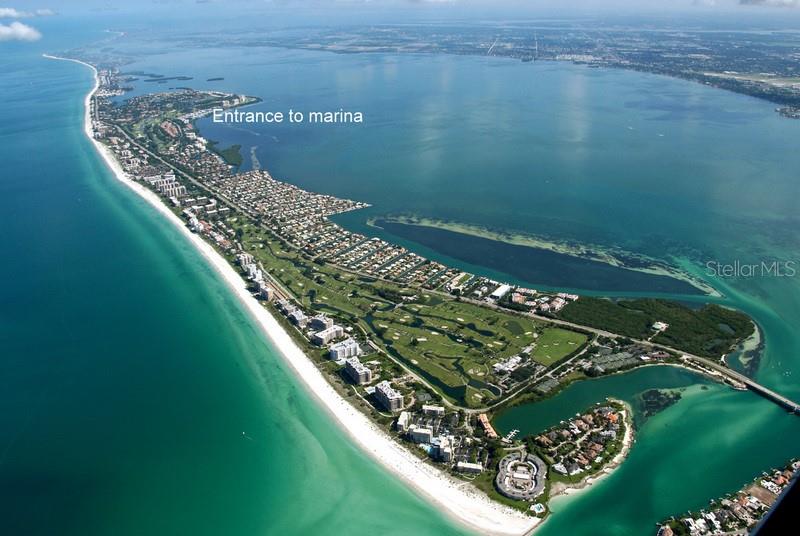 2800 Harbourside Drive, Unit E12 Longboat Key, FL 34228 - Photo 4 of 19 a view of a lake with a yard