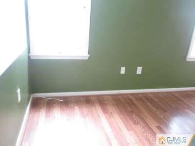 819 Edpas Road New Brunswick, NJ 08901 - Photo 3 of 6 a view of a room with wooden floor