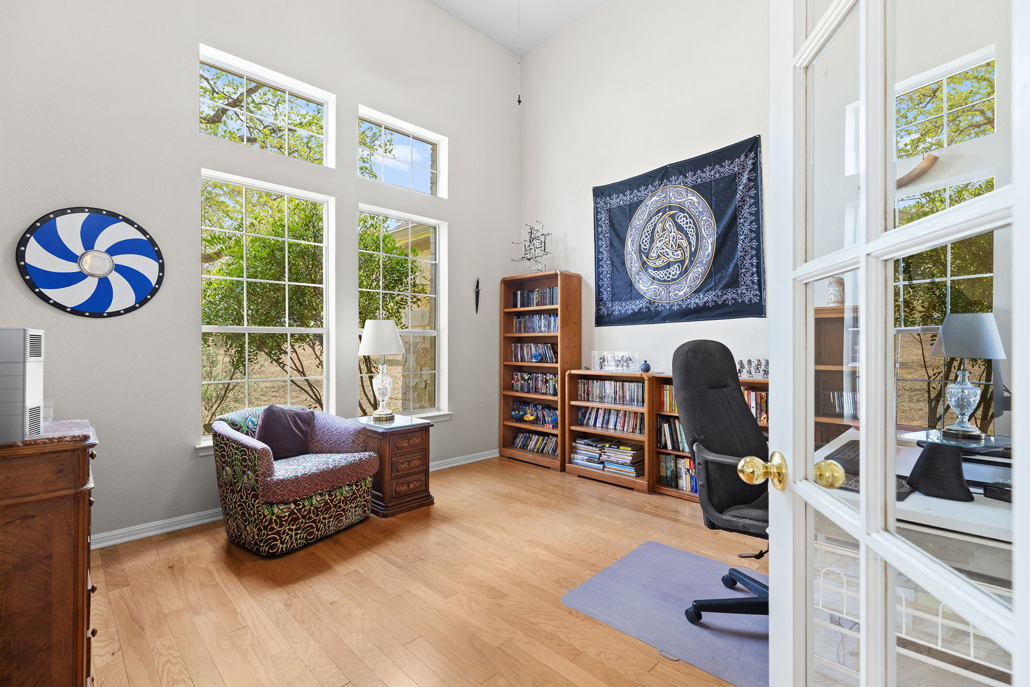 202 The Oaks Boulevard Elgin, TX 78621 - Photo 16 of 40 Office space with light wood finished floors, a high ceiling, and french doors