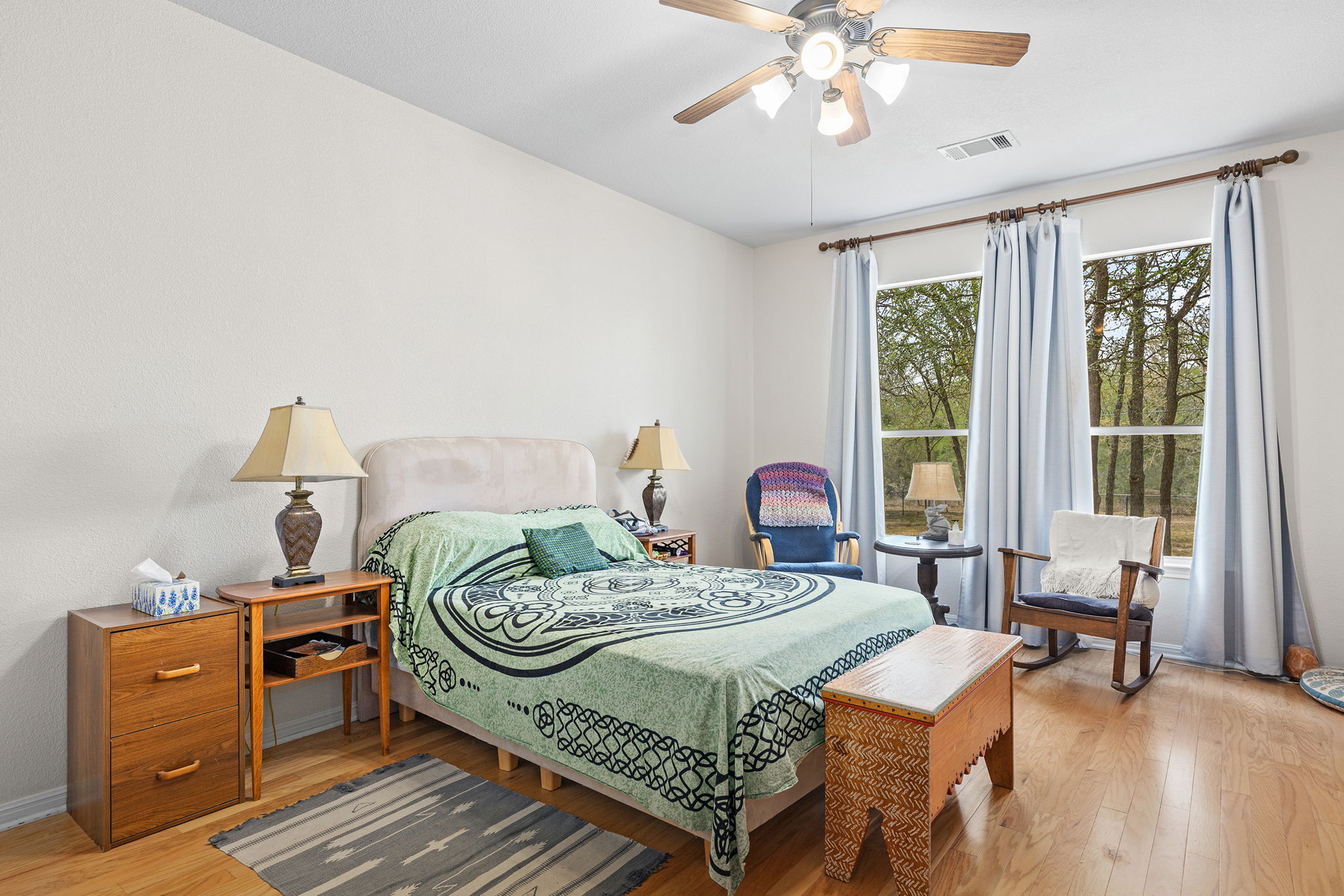 202 The Oaks Boulevard Elgin, TX 78621 - Photo 20 of 40 Bedroom with a ceiling fan and light wood-style floors