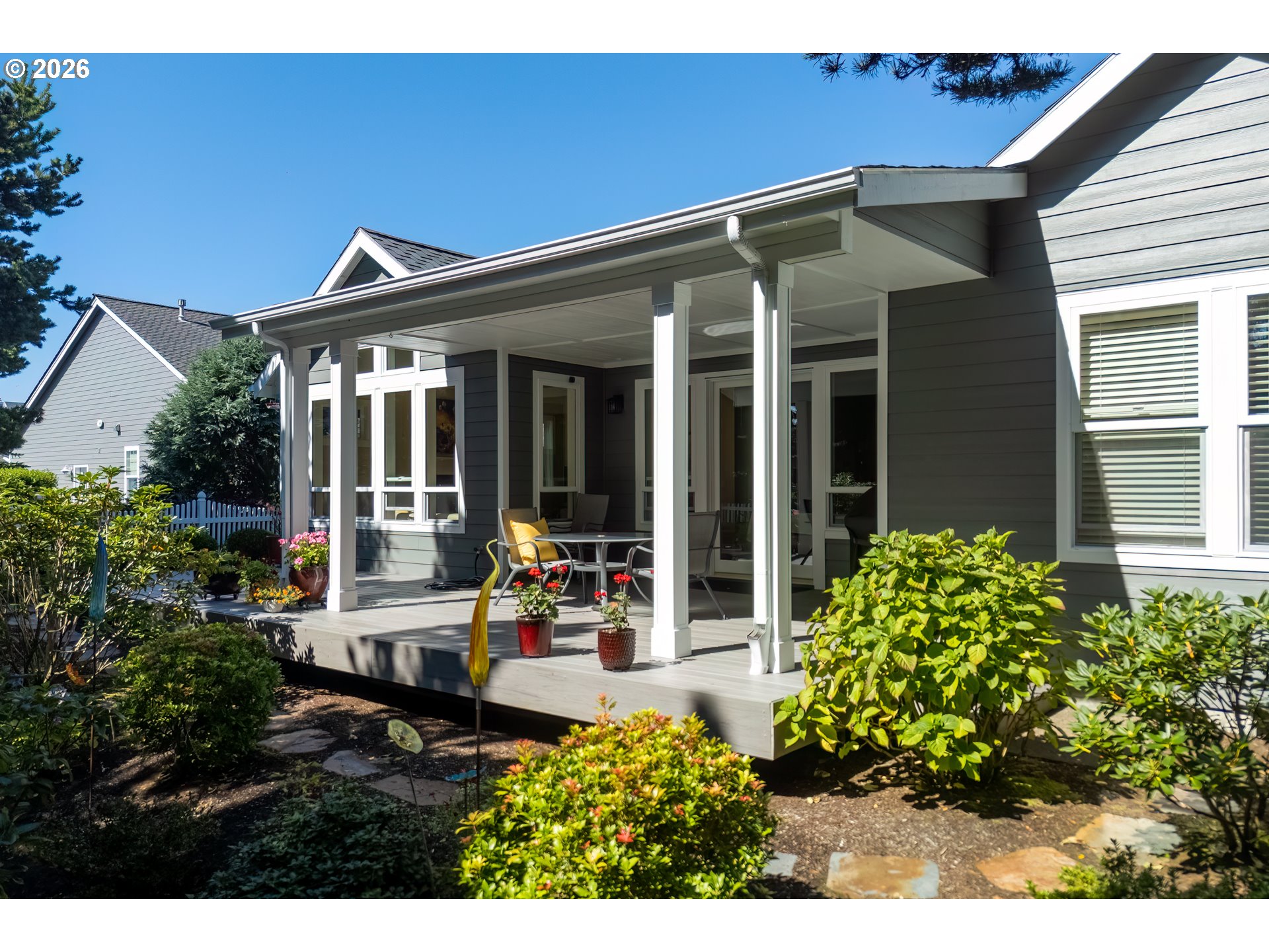 175 Southwest 59th Street South Beach, OR 97366 - Photo 11 of 48 a view of a house with patio outdoor seating and plants