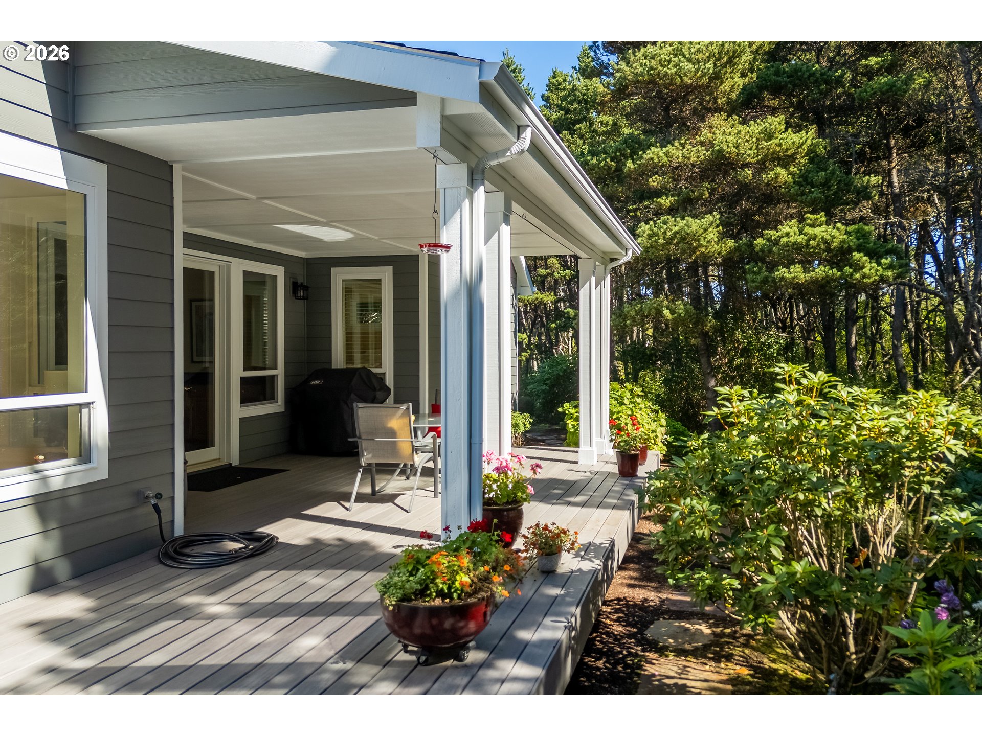 175 Southwest 59th Street South Beach, OR 97366 - Photo 12 of 48 a view of a house with patio