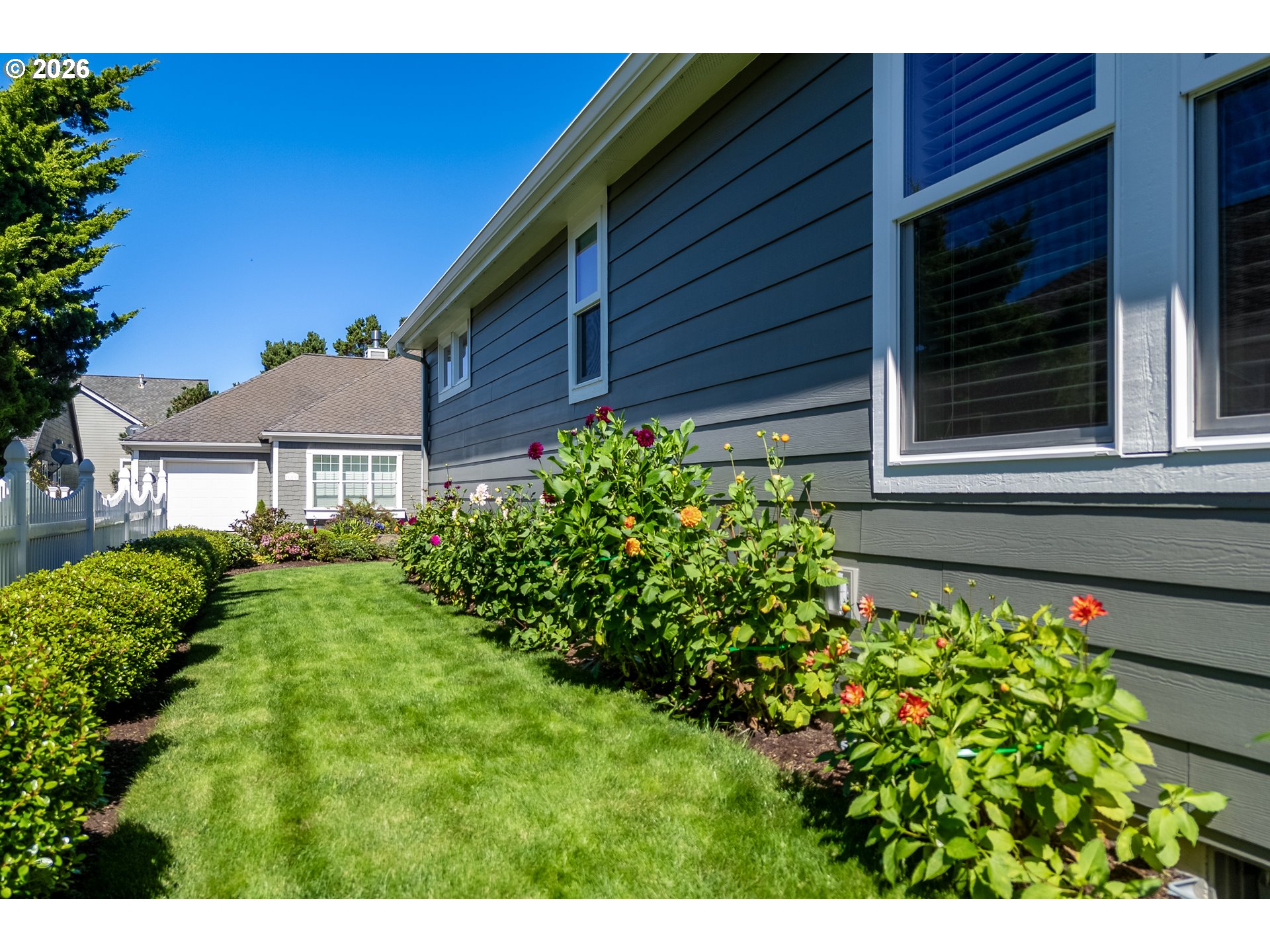 175 Southwest 59th Street South Beach, OR 97366 - Photo 13 of 48 a view of a house with a garden