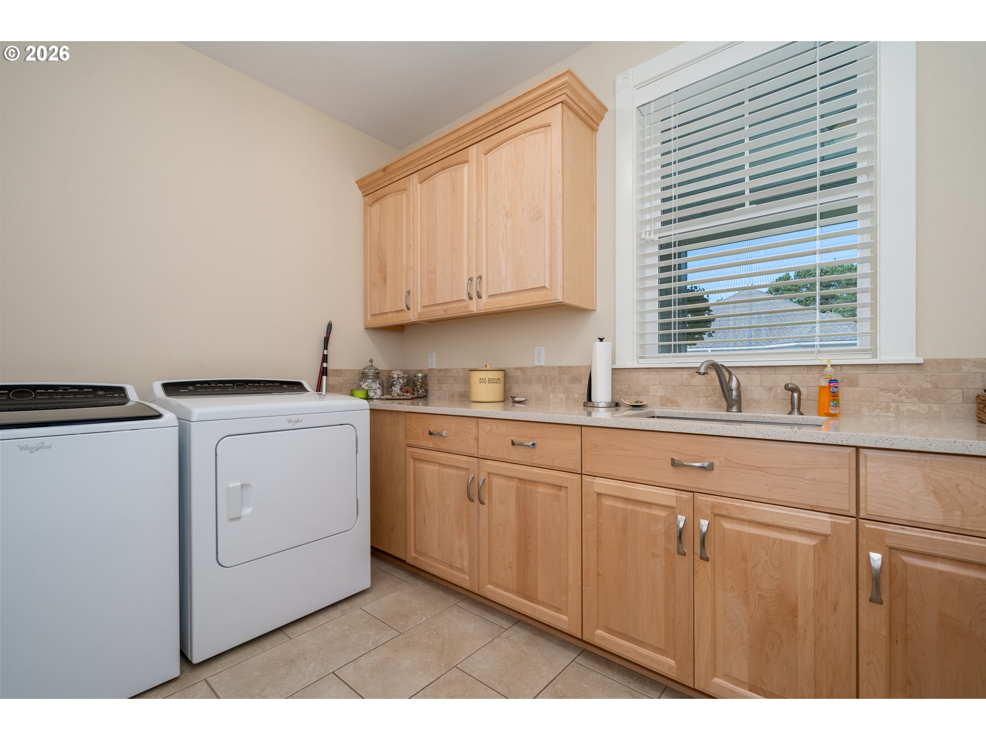 175 Southwest 59th Street South Beach, OR 97366 - Photo 20 of 48 a kitchen with sink cabinets and window